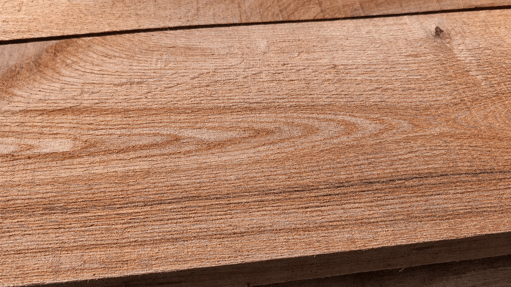 Rough sawn red oak lumber milled at The North River near Havelock, Ontario